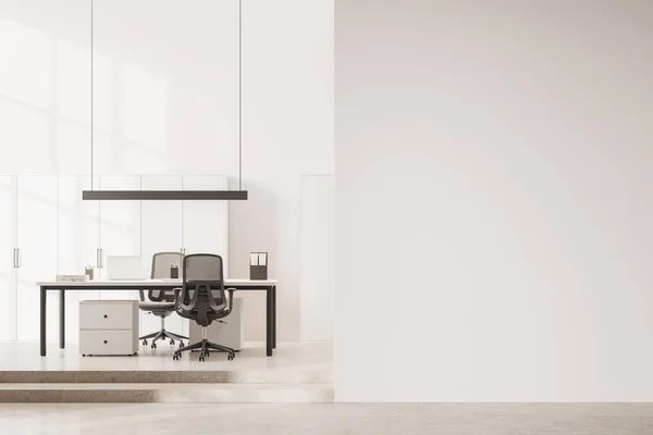 White office interior with laptop computer on work desk and chairs, podium stars on light granite floor. Consulting space with shelf, mockup copy space empty wall partition. 3D rendering