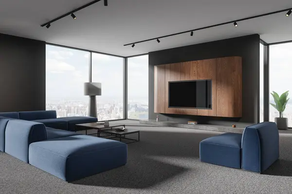 Corner of stylish living room with gray and wooden walls, carpeted floor, comfortable blue couch and armchair standing near coffee tables and TV set on the wall. 3d rendering