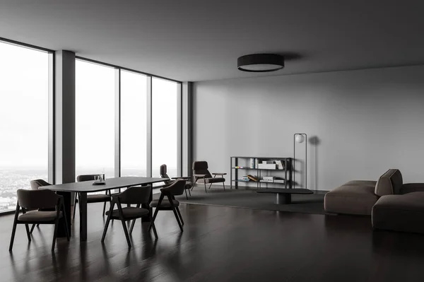 Dark home living room interior with eating table with chairs, side view brown sofa and armchairs. Scandinavian chill space with panoramic window on city view. 3D rendering