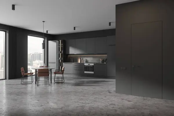 Dark home kitchen interior with dinner table and seats, side view invisible door and cooking space with cabinet. Panoramic window on Kuala Lumpur skyscrapers. 3D rendering