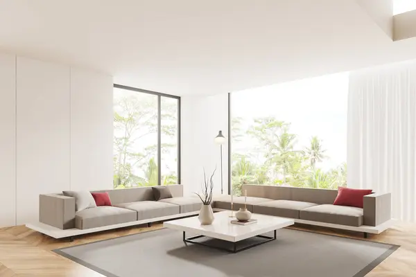 Corner of modern living room with white walls, wooden floor, two comfortable white couches standing on carpet near big windows and white square coffee table. 3d rendering
