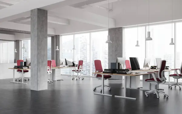 Corner of modern open space office with white and concrete walls, concrete floor, rows of computer desks with red chairs and columns. 3d rendering