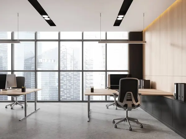 Modern office interior with chairs and pc computers, grey concrete floor. Minimalist coworking room with sideboard and panoramic window on Singapore skyscrapers. 3D rendering
