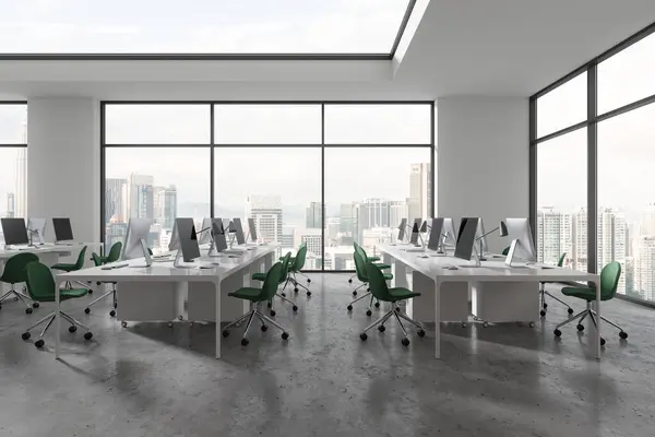 White workplace interior with pc computers and chairs, shared table on grey concrete floor. Coworking space near panoramic window on Kuala Lumpur skyscrapers. 3D rendering