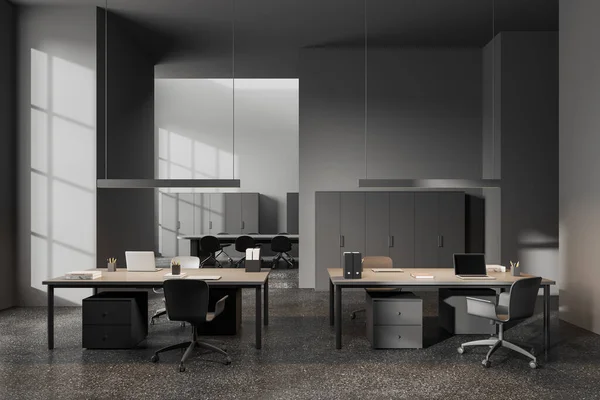 Dark office interior with chairs and table in row, grey granite floor. Business class room with laptop and meeting space with board on background. 3D rendering
