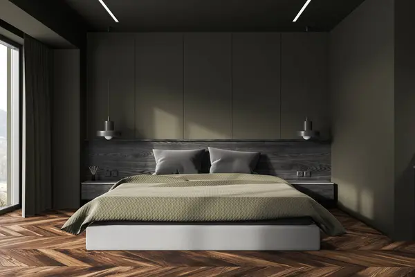 Interior of stylish bedroom with dark green walls, wooden floor, comfortable king size bed with green blanket and two cozy bedside tables. 3d rendering