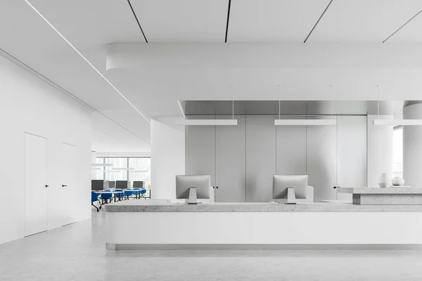White reception interior with pc desktop on table, light concrete floor. Workplace with computers and chairs in row near panoramic New York skyscrapers. 3D rendering