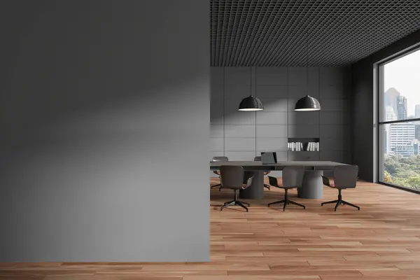 Interior of stylish office meeting room with gray walls, wooden floor, long conference table with chairs and copy space wall on the left. 3d rendering