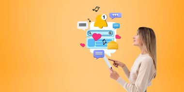 Portakal rengi fotokopi arkaplanının üzerinde renkli sosyal medya simgeleriyle duran tablet kullanan güzel bir Avrupalı kadının portresi. İletişim ve internet kavramı