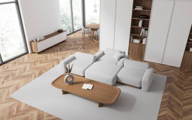 Otel odasının en üst manzarası. Kanepe, sehpa, yerde halı. Masası ve çekmecesi olan yemek alanı. Tropik bölgelerde raflar ve panoramik pencereler. 3B görüntüleme