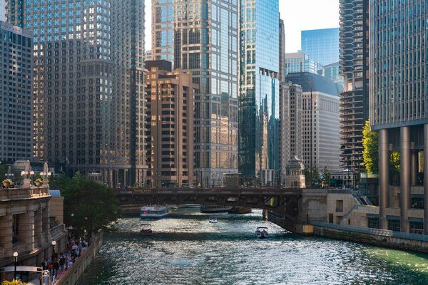 Chicago downtown district with office buildings and river embankment, business architecture and skyscrapers on a sunny day. Illinois, USA, North America