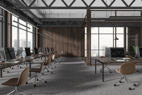 Dark modern wooden office interior with coworking room, pc computers on tables in row. Glass conference zone with panoramic window on Kuala Lumpur skyscrapers. 3D rendering