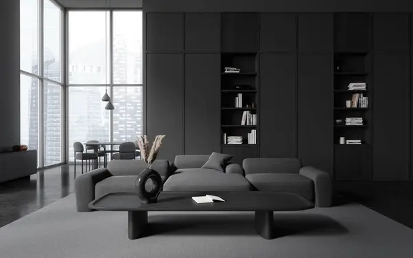 Dark home living room interior with sofa and shelf with books, dinner table with chairs behind partition. Panoramic window on Singapore skyscrapers. 3D rendering
