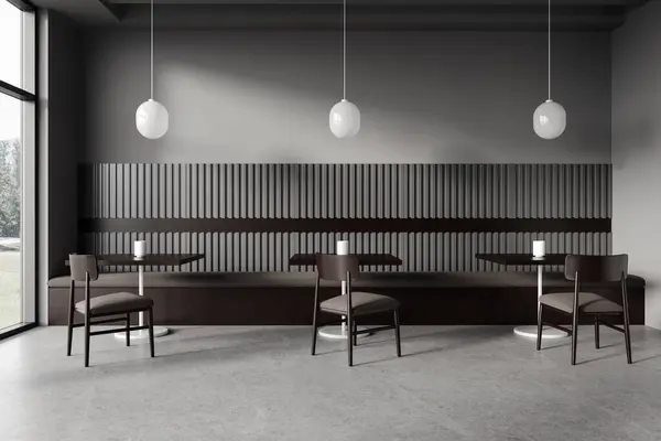 Dark restaurant interior with wooden chairs and table in row, grey concrete floor. Minimalist cafe design with panoramic window on countryside. 3D rendering