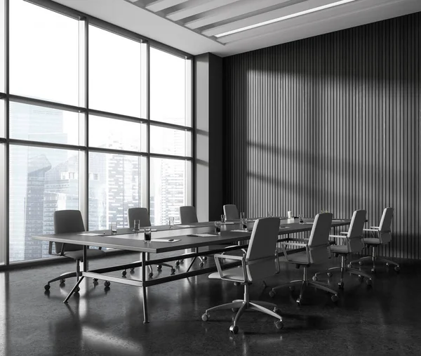Dark office interior with armchairs and board, side view grey granite floor. Stylish meeting corner and panoramic window on Singapore skyscrapers. 3D rendering