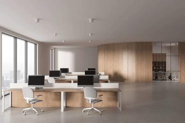 White and wooden office interior with coworking space, pc computers on desk in row. Glass conference room with panoramic window on Paris skyscrapers. 3D rendering