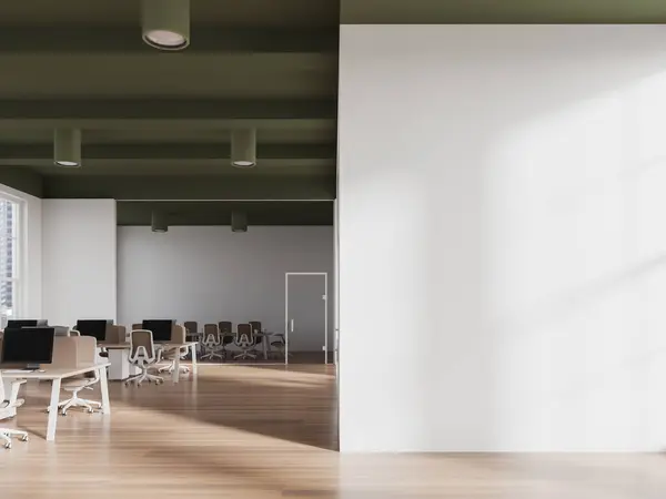 Interior of modern open space office with white walls, green ceiling, row of computer desks, conference room in background and copy space wall on the right. 3d rendering