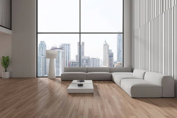 Light home living room interior with sofa and coffee table with decoration, lamp and plant on hardwood floor. Cozy relax zone with panoramic window on Bangkok skyscrapers. 3D rendering