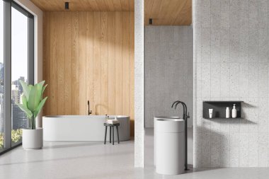 Modern banyo, beyaz ve ahşap duvarlar, beton zemin, rahat beyaz banyo küveti ve dikey aynalı yuvarlak lavabo. 3d oluşturma