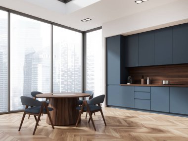 Beyaz duvarlı modern mutfak, ahşap zemin, mavi dolaplar ve dolaplar ve sandalyeli yuvarlak yemek masası. 3d oluşturma