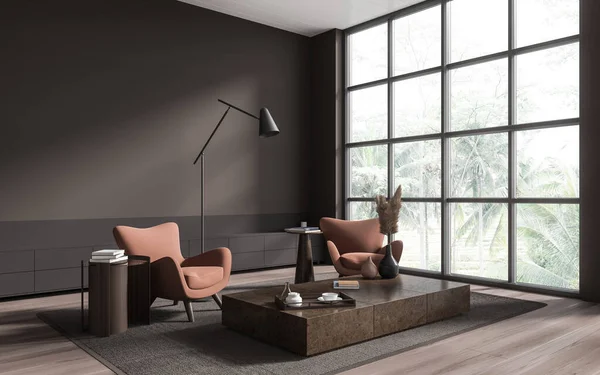 Corner of stylish living room with brown walls, wooden floor, two comfortable peach armchairs standing near coffee table and panoramic window. 3d rendering