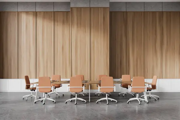 Office conference room interior with brown armchairs in row, wooden board on grey concrete floor. Stylish meeting area with minimalist furniture. 3D rendering