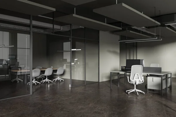Corner of stylish open space office with green walls, concrete floor, row of computer desks with gray chairs and conference room next to it. 3d rendering