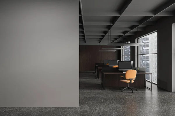 Dark office interior with pc desktop on work table in row. Stylish workplace with panoramic window on Singapore skyscrapers. Mockup blank empty wall partition. 3D rendering