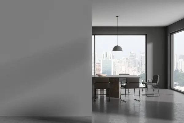 Dark home living room interior with dinner table and chairs, grey concrete floor. Minimalist eating or relaxing area with panoramic window on Singapore. Mockup copy space empty wall. 3D rendering
