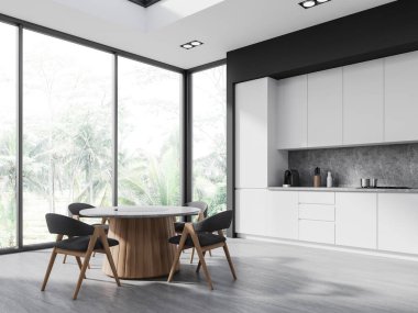 Gri duvarları, beton zemini, beyaz dolapları, dolapları ve sandalyeli yuvarlak yemek masası olan şık bir mutfak. 3d oluşturma