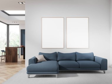 Beyaz duvarları, ahşap zemini, rahat mavi koltuğu ve iki dikey maket posterli modern oturma odasının içi. Arka planda ada olan mutfak. 3d oluşturma