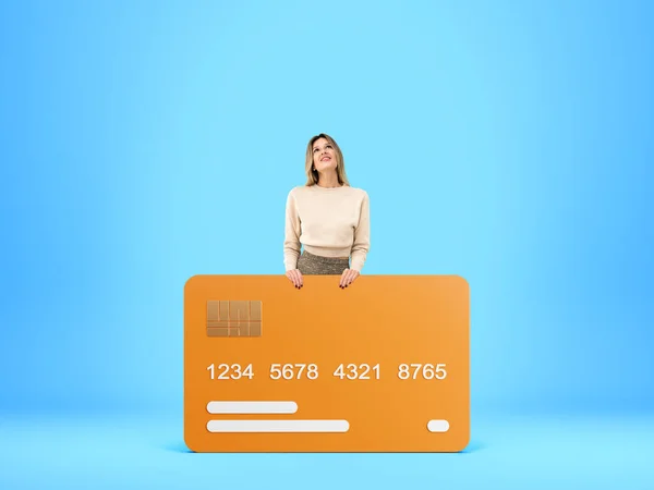 Happy Dreaming Woman Mock Orange Credit Card Copy Space Empty — Stock Photo, Image
