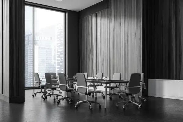Stylish black wooden meeting interior with chairs and board, side view grey concrete floor. Minimalist meeting corner and panoramic window on Singapore skyscrapers. 3D rendering
