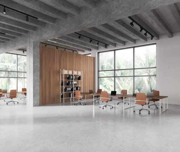 Corner of modern meeting room with white and wooden walls, concrete floor, long conference table with orange chairs and bookcase with folders. 3d rendering