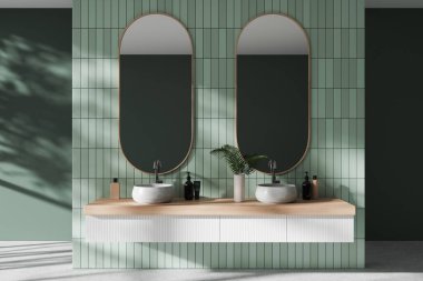 Yeşil fayanslı otel banyosu çift lavabo, aksesuarlı gösteriş ve iki oval ayna. Lüks dairenin tuvaletinde. 3B görüntüleme