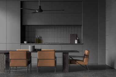 Dark home kitchen interior with eating table and chairs, minimalist cabinet with kitchenware and stove. Cooking and eating space on grey granite floor. 3D rendering