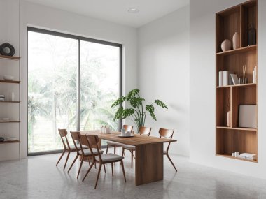 White home living room interior with table and chairs, side view minimalist shelf with decoration on light concrete floor. Panoramic window on tropics. 3D rendering