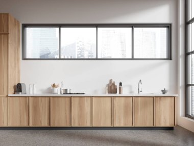 Modern home kitchen interior with sink and kitchenware, grey concrete floor. Stylish cooking cabinet in luxury apartment. Panoramic window on Singapore skyscrapers. 3D rendering
