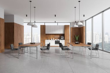 White and wooden office kitchen interior with tables and chairs in row, tile concrete floor. Cooking cabinet with shelves. Panoramic window on Singapore skyscrapers. 3D rendering