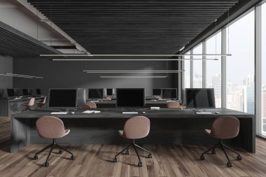 Dark office interior with seats and pc desktop, shared table on hardwood floor. Office business workspace and panoramic window on Singapore skyscrapers. 3D rendering