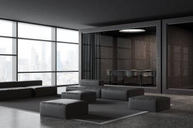 Dark business interior with chill and glass conference box with board, side view modular sofa pouf on carpet, grey granite floor. Panoramic window on Bangkok skyscrapers. 3D rendering