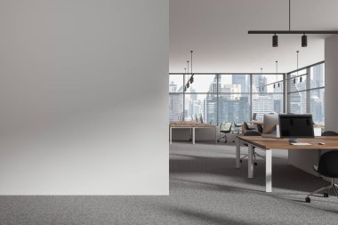 Industrial office interior with pc computers and shared desk in row, carpet on the floor. Stylish coworking space with panoramic window on Bangkok skyscrapers. Mockup empty wall. 3D rendering