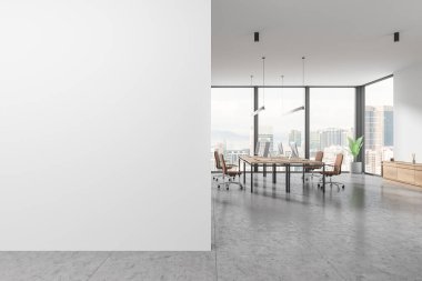 White business interior with pc monitors on desk, sideboard on light tile concrete floor. Coworking room with panoramic window on Kuala Lumpur. Mockup blank empty partition. 3D rendering