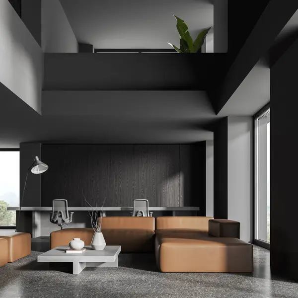 Two-storey office interior with lounge zone, sofa and coworking space with furniture. Panoramic window on countryside. Dark cozy workplace with technology. 3D rendering