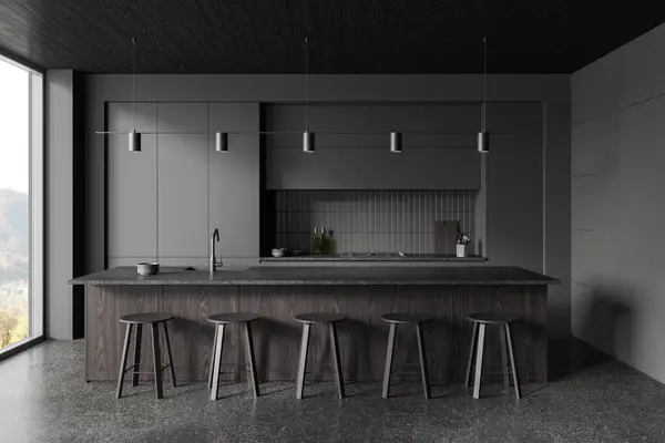Dark hotel kitchen interior with bar island and stool, cabinet with kitchenware. Eating and cooking space, panoramic window on countryside. 3D rendering
