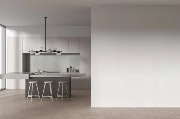 Interior of modern kitchen with beige walls, concrete floor, beige cupboard and cabinets with built in cooker and cozy island with chairs. Copy space wall on the right. 3d rendering
