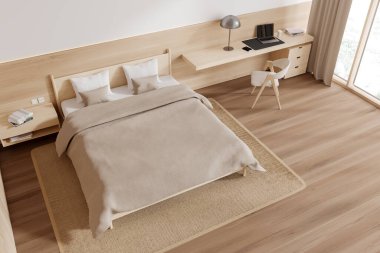 Otelin yatak odası, yatak odası, çalışma masası, ahşap zeminde sandalye ve halı manzarası. Çalışma alanı olan rahat bir uyku köşesi, tropik bölgelerde panoramik pencere. 3B görüntüleme