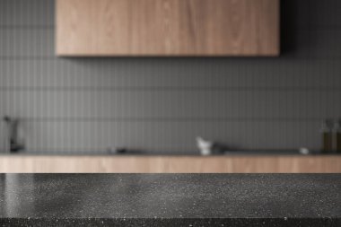 Koyu taş ürün masası gri fayanslı duvarları, ahşap dolapları ve dolapları olan şık, bulanık bir mutfakta duruyor. 3d oluşturma