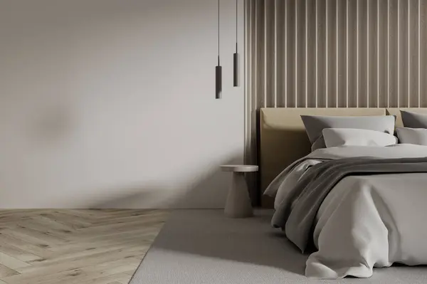 Interior of modern bedroom with white walls, wooden floor, comfortable king size bed with gray cover standing on gray carpet and copy space wall on the left. 3d rendering
