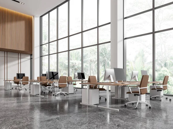 Corner of stylish open space office with white and wooden walls, marble floor and rows of computer tables standing near panoramic window. 3d rendering